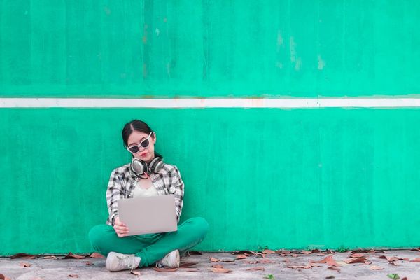 Girl with laptop and headphones