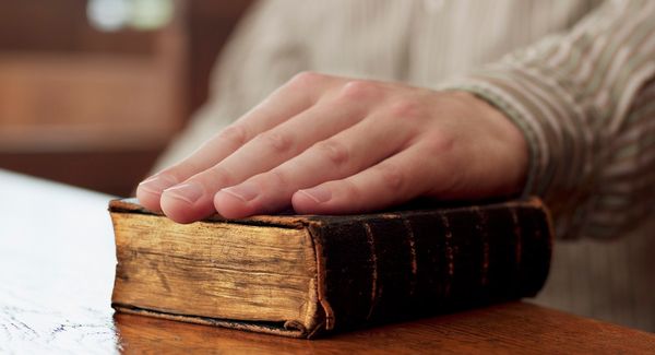 swearing in court on a Bible, so help me God