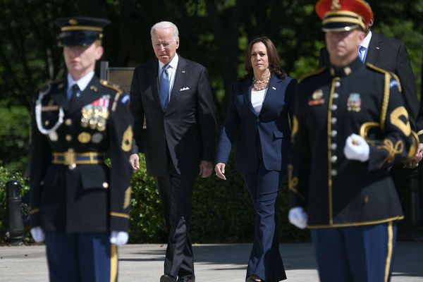 Kamala Harris and Joe Biden seen along with servicemembers of the U.S. military