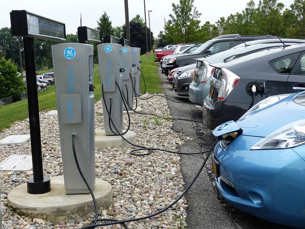 A meme did not show coal powered electric cars in a parking lot.