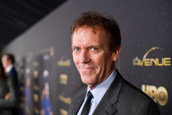 Hugh Laurie did not transition or identify as a transgender woman despite a misleading ad that showed a doctored picture of the actor with the word "her."