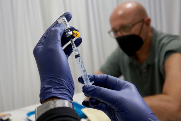 WILTON MANORS, FLORIDA - JULY 12: A healthcare worker prepares to administer a vaccine to Michael Nicot for the prevention of monkeypox the Pride Center on July 12, 2022 in Wilton Manors, Florida. The center is offering the free smallpox/monkeypox vaccinations from the Florida Department of Health in Broward County as South Florida leads the state in the number of people infected. (Photo by Joe Raedle/Getty Images)