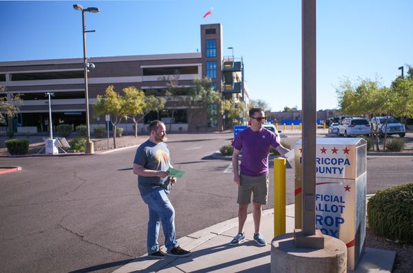 Voters have encountered armed poll ‘watchers’ in Mesa, Arizona.
