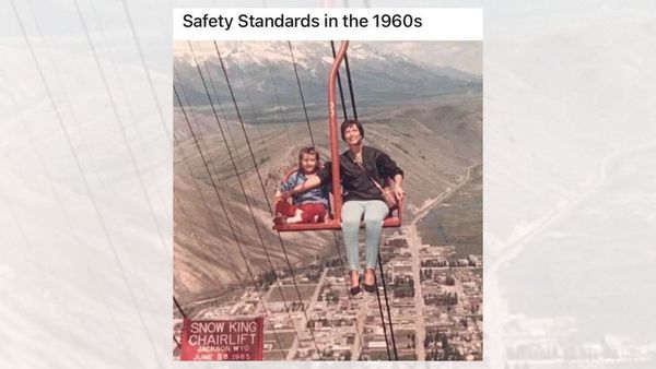 An adult holds their arm in front of a child on a chairlift. The caption reads, "Safety Standards in the 1960s."