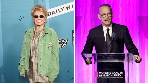 A white woman and man are pictured on the same image. The woman is on the left and wearing sunglasses, while the man is on the right and wearing a black suit.