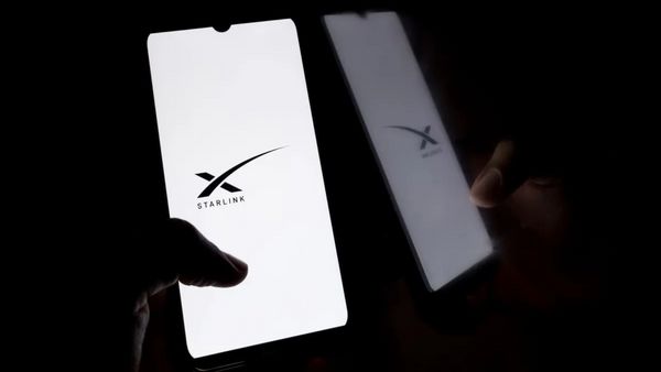 A phone shows the logo for STARLINK, a black X with one line going far to the right.