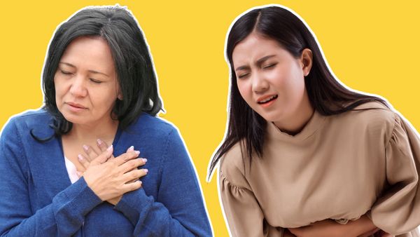 A woman clutches her heart. Next to her, a woman looks to be in pain as she clutches her stomach.