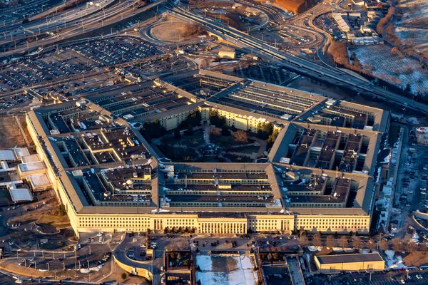 Aerial view of the Pentagon, a pentagon-shaped concrete building housing the Department of Defense. 