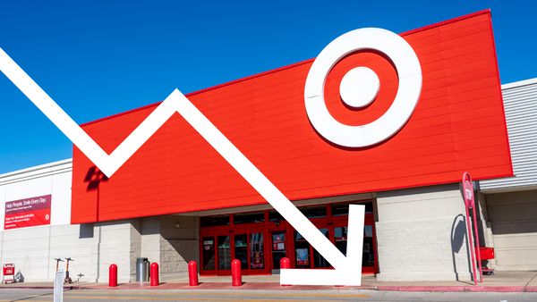 A white arrow is overlaid an image of a store that has a white bullseye sign attached.