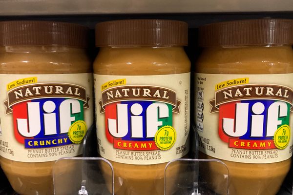 Three bottles of Natural Jif Creamy peanut butter are shown next to each other.