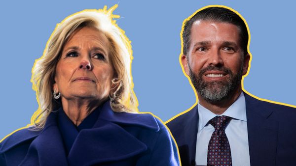 A white woman is pictured next to a white man. The woman wears a dark blue jacket, while the man wears a dark blue suit.