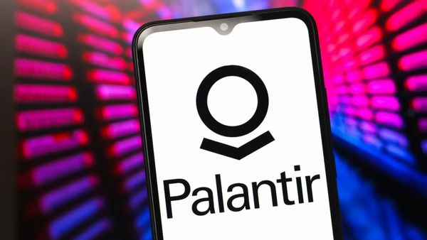 A phone app says "Palantir" surrounded by pink and purple light.
