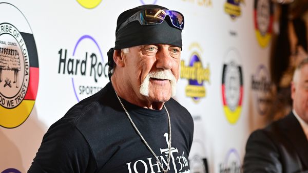 A white man wearing a black shirt that says JOHN 3:16 and black cap looks towards the camera.