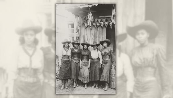 An image appearing to show five Black women wearing cowboy hats and corseted or belted gowns. 