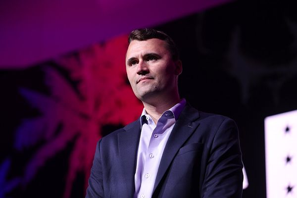 A white man with short brown hair wearing a suit. 
