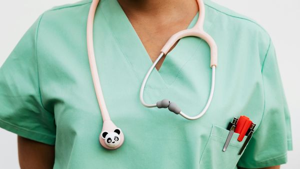 close up picture of a nurse uniform with a panda stethoscope 