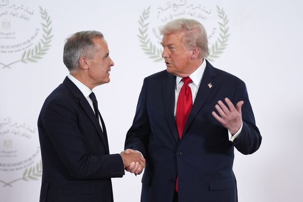 Canadian Prime Minister Mark Carney shakes hands with U.S. President Donald Trump. 