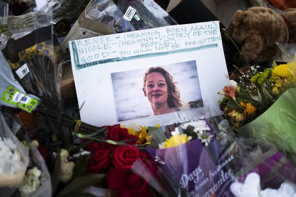 A memorial for Renee Nicole Good, who was fatally shot by a U.S. Immigration and Customs Officer. The memorial has a picture of her in the center surrounded by flowers.