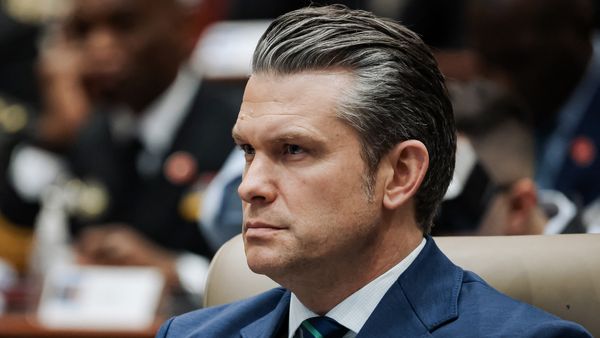 Defense Secretary Pete Hegseth, a white man with slicked back salt and pepper hair. 