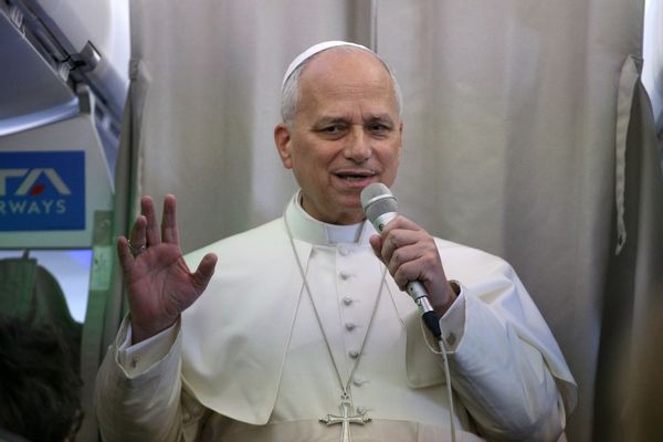 Pope Leo XIV speaks to journalists aboard a plane.