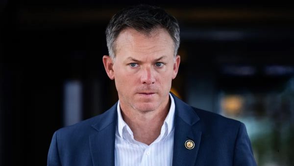 Image shows Rep. Blake Moore leaving a meeting of the House Republican Conference at the Capitol Hill Club in 2025.