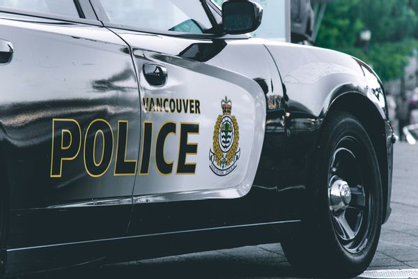 A police car labeled "Vancouver Police." 