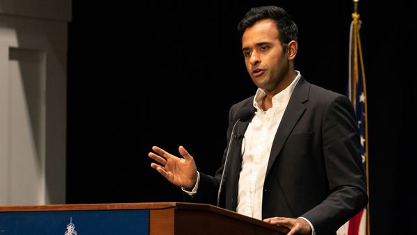 Vivek Ramaswamy, a younger Indian man running for Ohio governor, wears a suit and speaks into a microphone at a lectern.