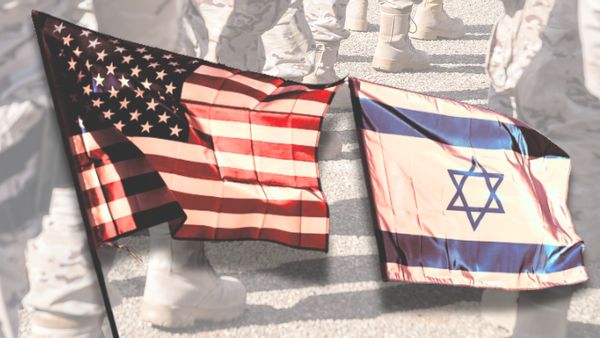 An U.S. flag is shown next to an Israeli flag. In the background, the boots of military officers can be seen.