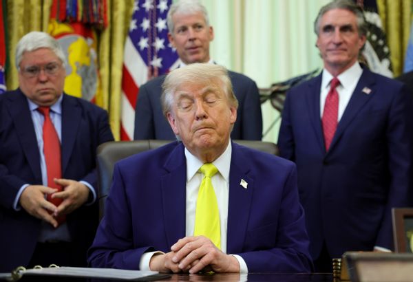 Image shows Trump with his eyes closed.