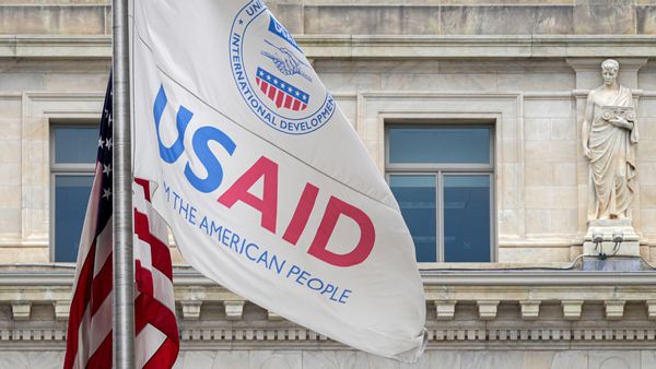The US Agency of International Development flag flies outside the agency's headquarters building in Washington, DC.