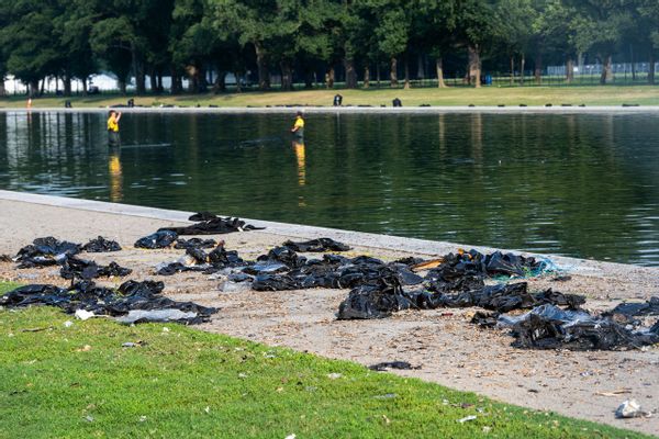 Trash and debris scattered near the Reflecting Pool. 