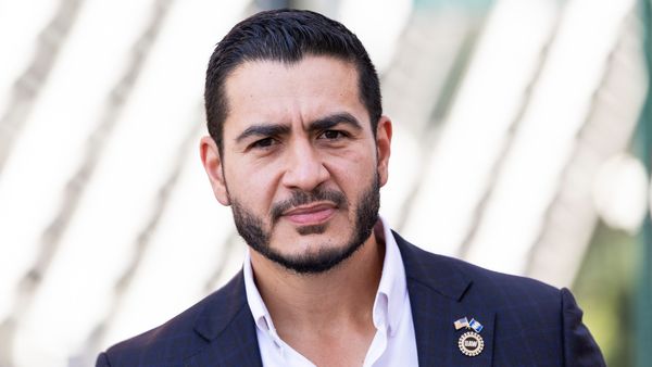 Michigan U.S. Senate candidate Abdul el-Sayed, an Egyptian American man with short black hair and a short beard wearing a navy blue suit. 
