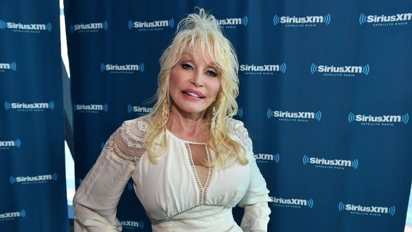 Image shows Dolly Parton standing at the SiriusXM Nashville Studios.