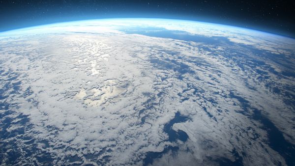 An image shows a view of Earth from space, with the planet taking up much of the frame.