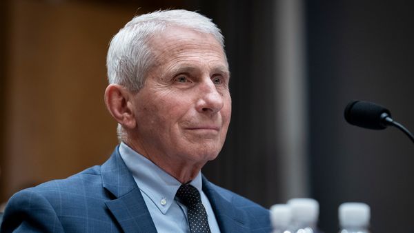 Dr. Anthony Fauci, an older white man with cropped white hair in a blue suit. 