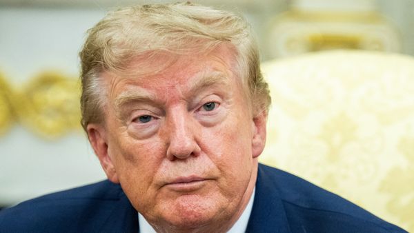U.S. President Donald Trump, a white, tan man with short blonde hair in a suit. 