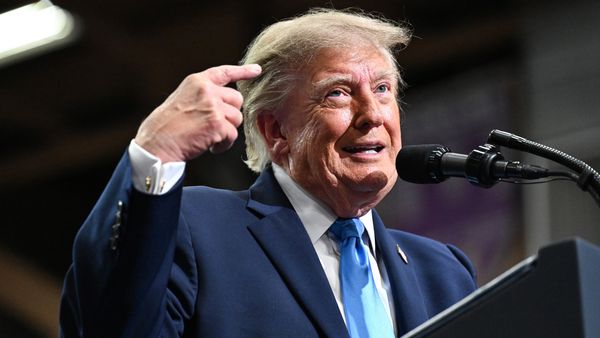 U.S. President Donald Trump speaks in Vandalia, Ohio, wearing a navy suit, blue tie and white shirt.